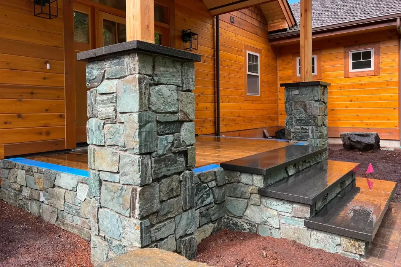 Installation of Black Basalt Capstones and stair treads